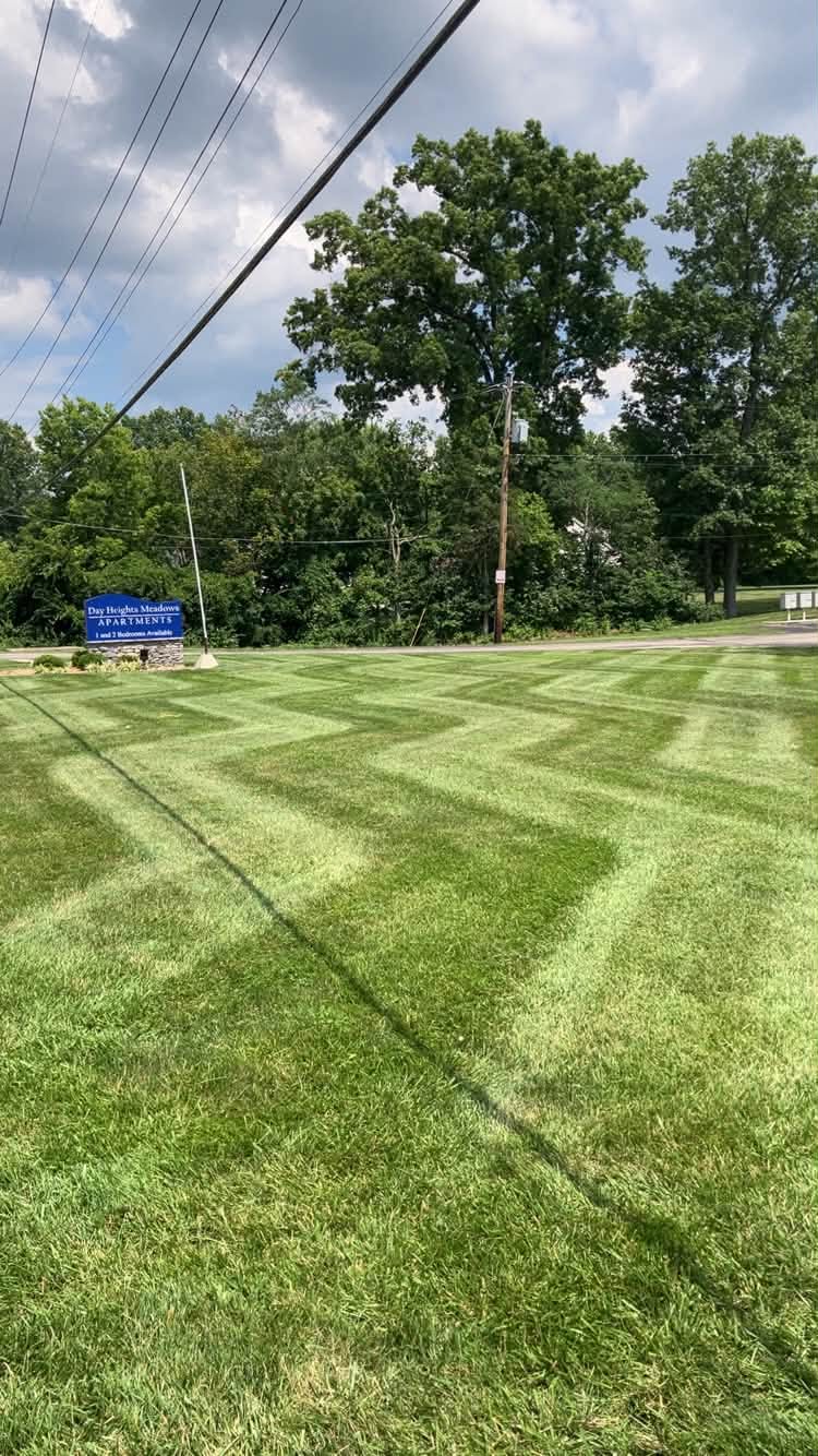 Freshly striped commercial lawn maintained by TJ's Landscaping