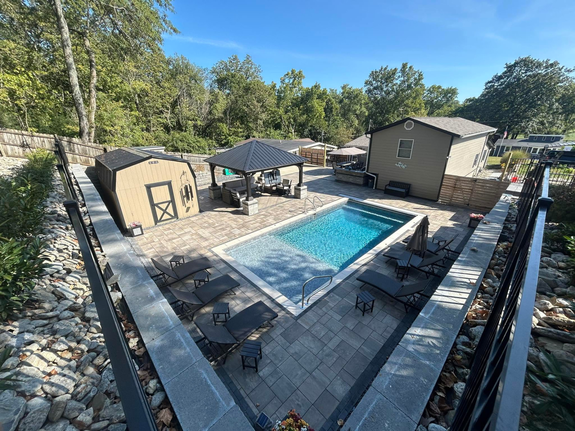 Full paver pool deck and hardscape installation with landscape borders